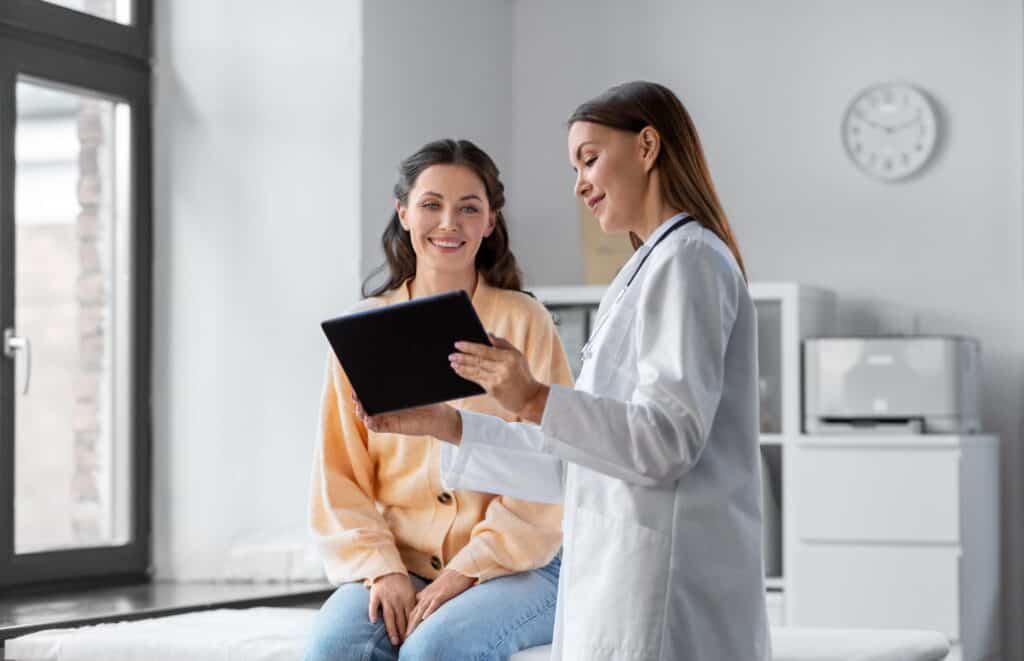 A woman discusses a MAT program in California with a medical professional.