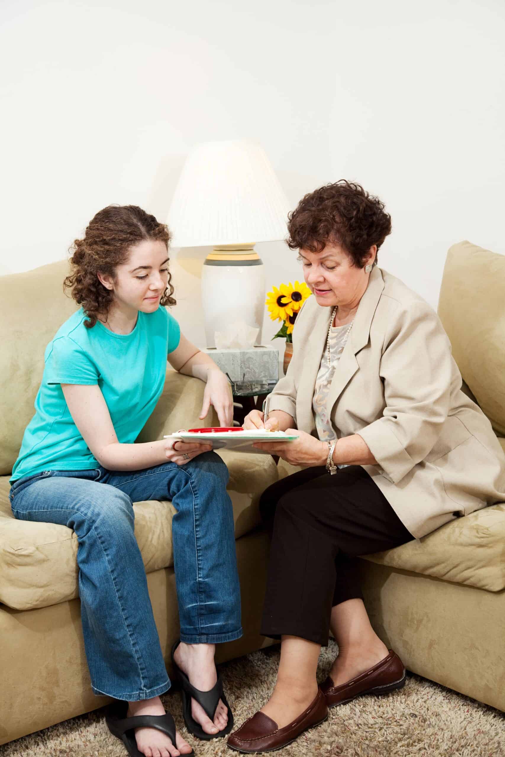 A young woman enjoys Adolescent therapy through individual therapy.