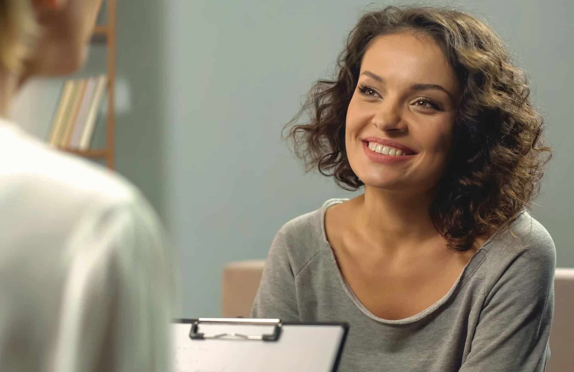 A woman talks to a professional about medical detox in Monterey, CA.