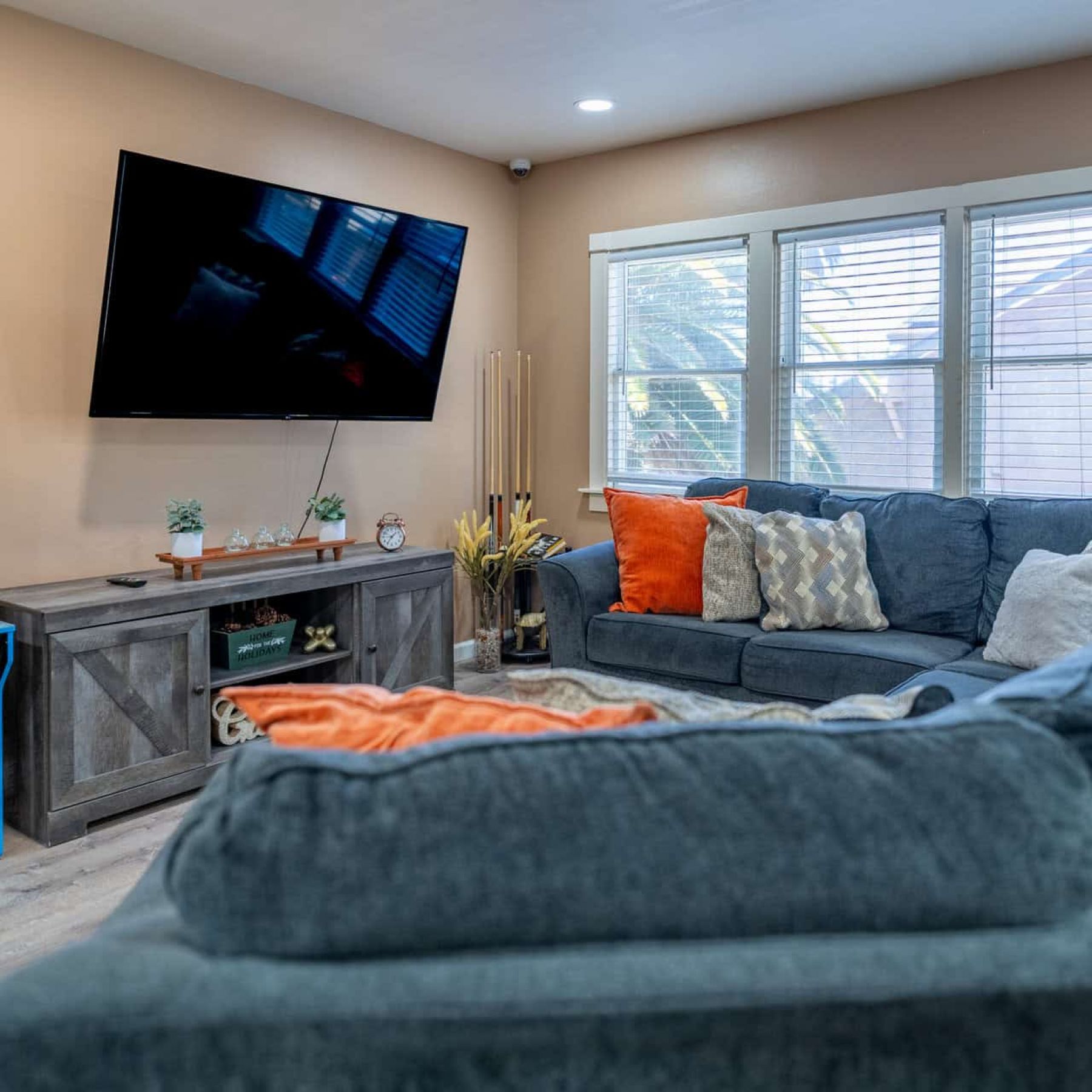 Living room with a sofa and TV in our residential rehab in Concord, CA.